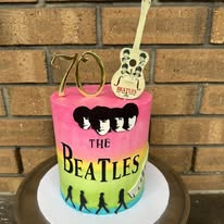 Beatles 70th birthday cake with hand-painted Abbey Road artwork and guitar topper